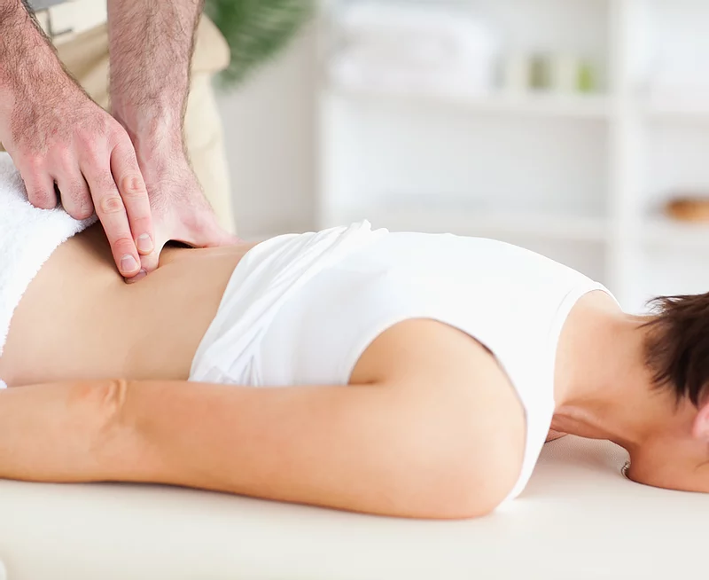 Person performing chiropractic care in Scottsdale, Arizona