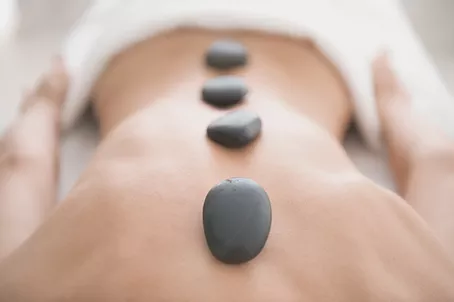 Person enjoying a hot stone massage in Scottsdale, Arizona