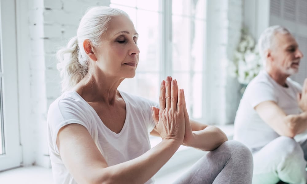 Two people meditating