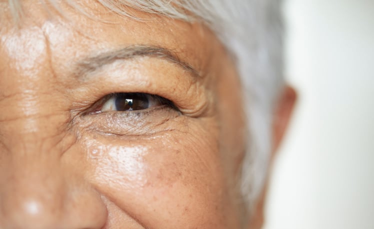 Aged woman looking straight ahead